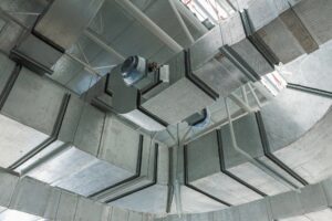 Air conditioning and ventilation system work, duct pipes covered with moisture-proof insulation