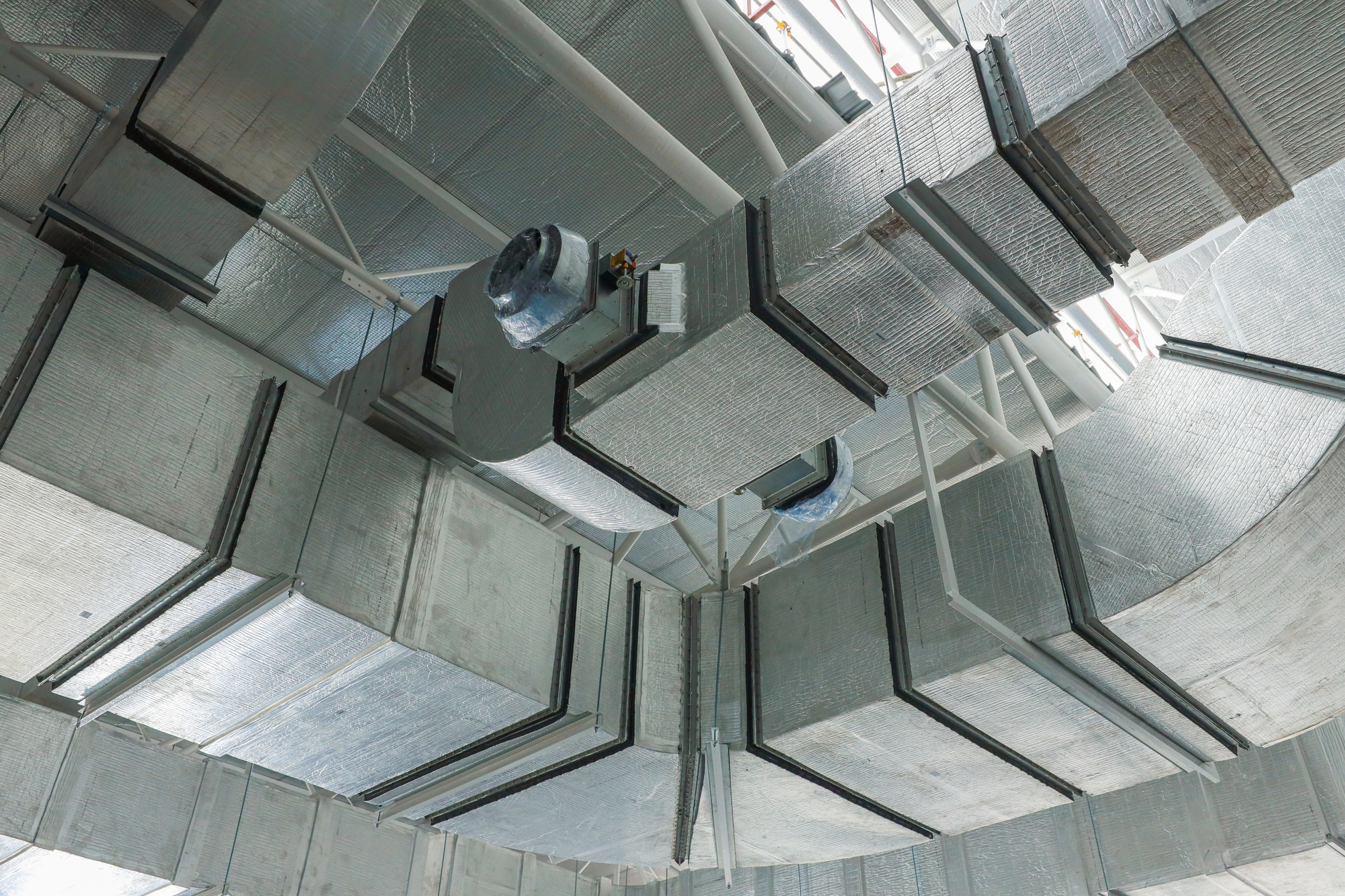 Air conditioning and ventilation system work, duct pipes covered with moisture-proof insulation